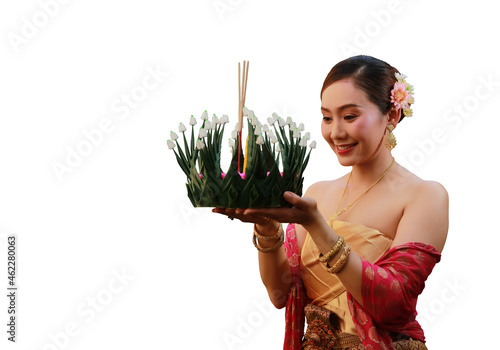 Joyful Asia woman lift Kra-Thong up to pray respect to Goddess of water on November, Loy krathong festival in Thaland photo