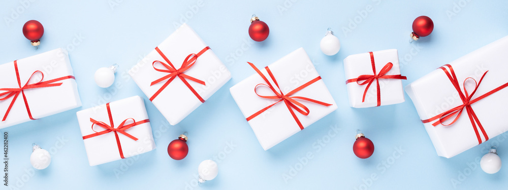 Banner with white Christmas gift boxes on blue background. Banner with white Christmas gift boxes on blue background.