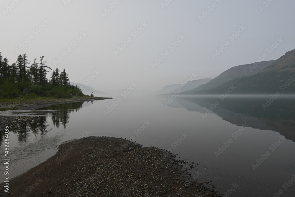 Putorana plateau, fog over a mountain lake.