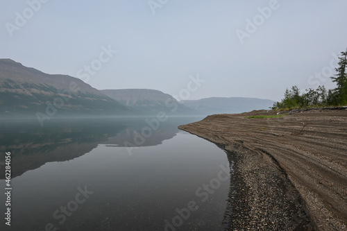 Putorana plateau, fog over a mountain lake. © sergunt