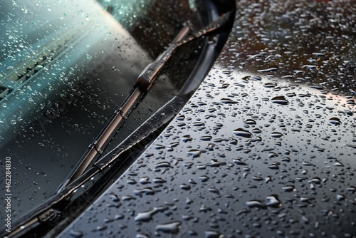 rain drops on car windshield and hood