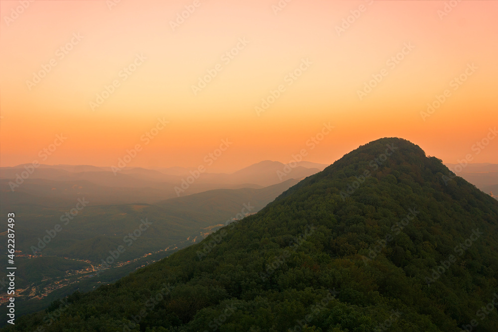 top view of a mountain landscape and a scarlet sunset
