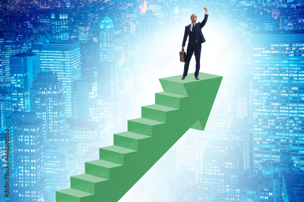 Businessman climbing career ladder in business concept Businessman climbing career ladder in business concept