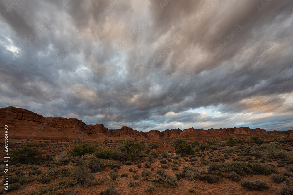 Dramatic stormy sunset sky over desert landscape, Moab Utah