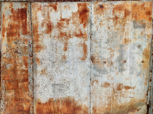 Corroded metal background. Rusty metal background with streaks of rust. Rust stains. Rystycorrosion.