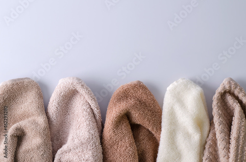 Layout of clean cotton towels in a row.