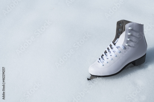 white ice skate in natural snow