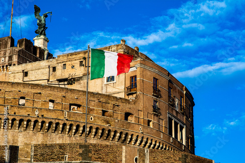 Photography In Italian flag is waving on the Castle Sant Angelo (Mausoleum of Hadrian) in Ro
