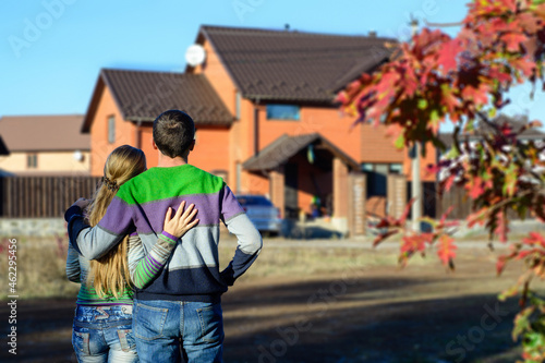 Loving couple looking at their dream house. copy space