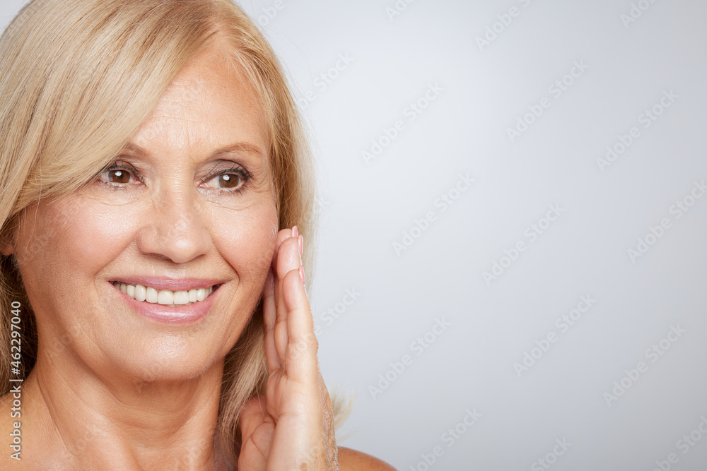 Portrait of beautiful blond senior woman posing and looking away. Beauty photography Portrait of beautiful blond senior woman posing and looking away. Beauty photography