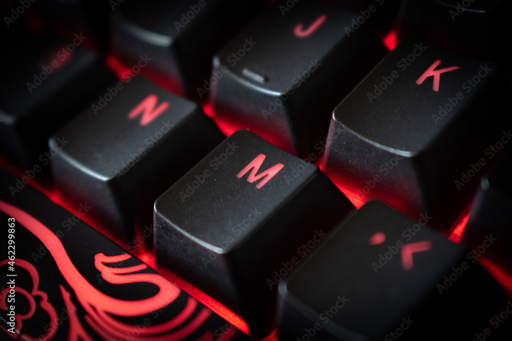 Red Backlit Mechanical Keyboard with black, white, red keycaps at an angle Red Backlit Mechanical Keyboard with black, white, red keycaps at an angle
