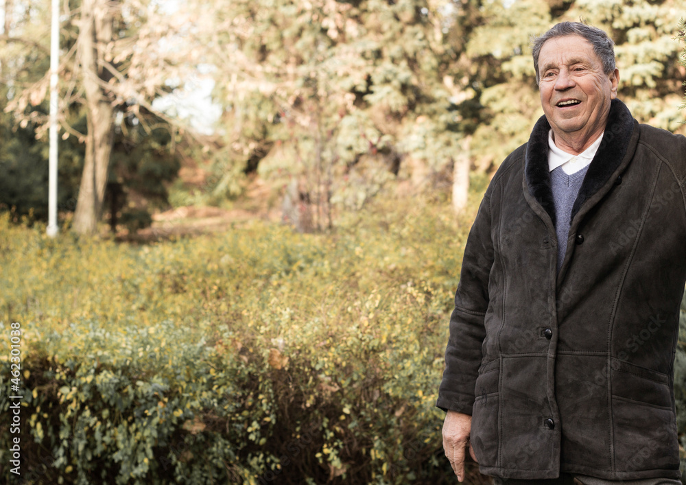 Portrait of happy and laughing senior man. Elder health and retirement concept Portrait of happy and laughing senior man. Elder health and retirement concept