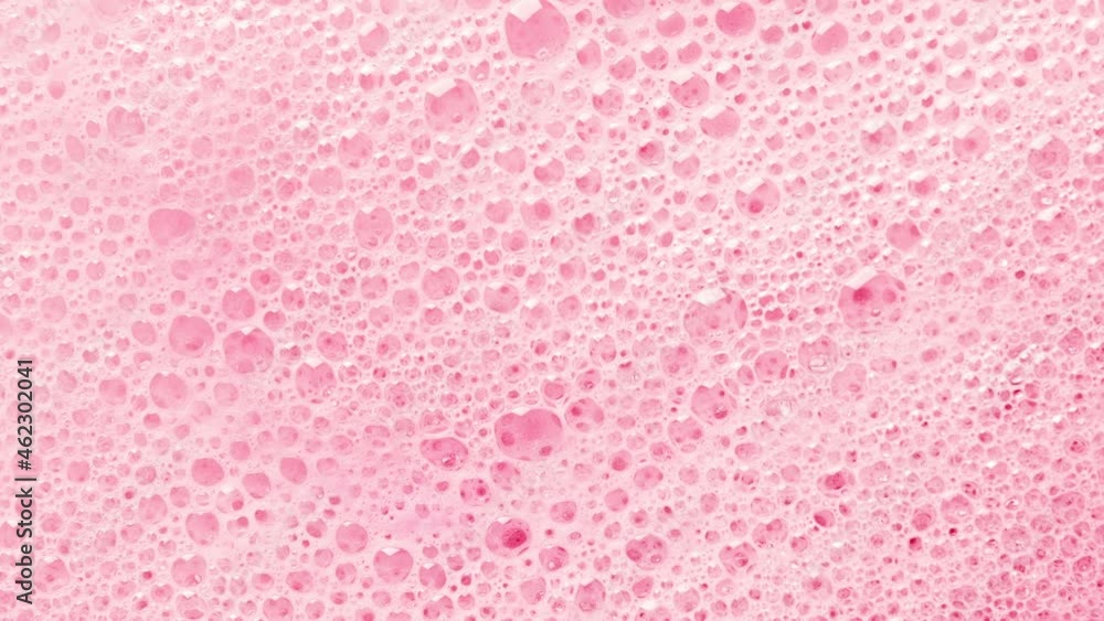 Texture of pink soap foam with bubbles abstract background. Cosmetic for body and shower. Texture of pink soap foam with bubbles abstract background. Cosmetic for body and shower.