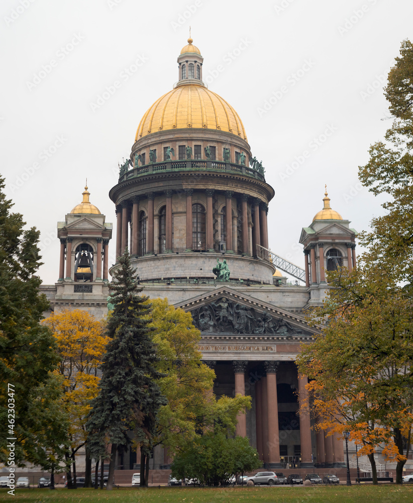 St. Isaac's Cathedral in autumn, Saint Petersburg, Russia. Saint Isaac's Cathedral surrounded by trees. Built in 1818-1858