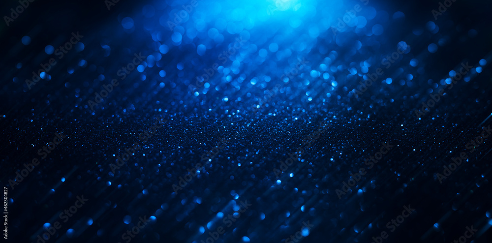 Abstract background of blue glitter lights. De-focused background. Banner size Abstract background of blue glitter lights. De-focused background. Banner size