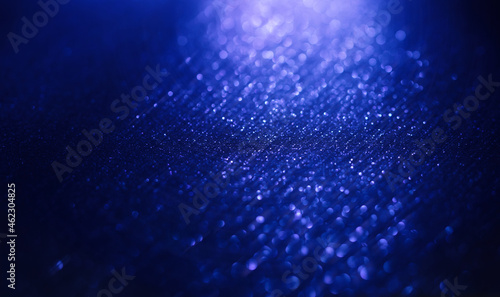 Abstract background of blue glitter lights. De-focused background. Banner size
