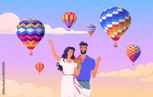 Romantic engagement of a young couple on a background of colored balloons