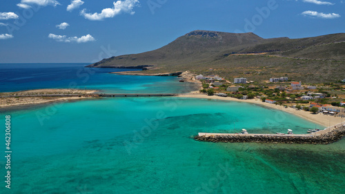 Fototapeta Naklejka Na Ścianę i Meble -  Aerial drone photo of main port of Kythera island and turquoise exotic beach of Diakofti, Ionian, Greece