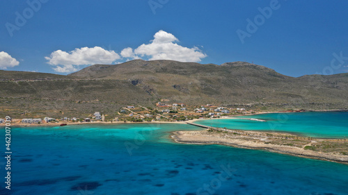 Aerial drone photo of main port of Kythera island and turquoise exotic beach of Diakofti, Ionian, Greece