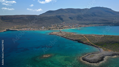 Aerial drone photo of main port of Kythera island and turquoise exotic beach of Diakofti, Ionian, Greece