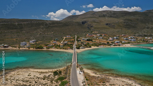 Aerial drone photo of main port of Kythera island and turquoise exotic beach of Diakofti, Ionian, Greece photo