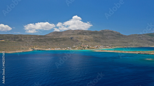 Aerial drone photo of main port of Kythera island and turquoise exotic beach of Diakofti, Ionian, Greece photo