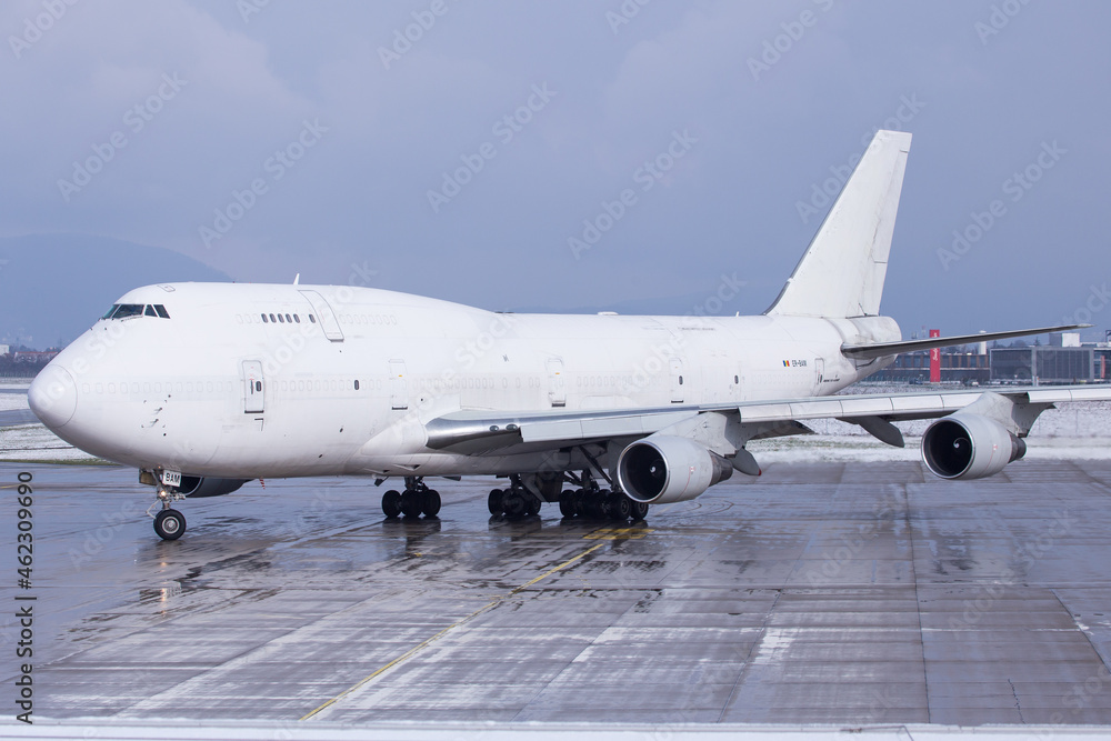 White Boeing 747-400 Jumbo Jet freighter on the ground in Graz, Austria White Boeing 747-400 Jumbo Jet freighter on the ground in Graz, Austria