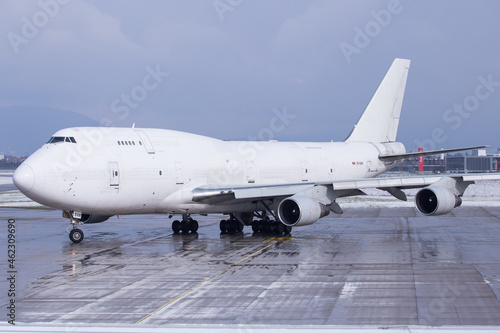 White Boeing 747-400 Jumbo Jet freighter on the ground in Graz, Austria photo