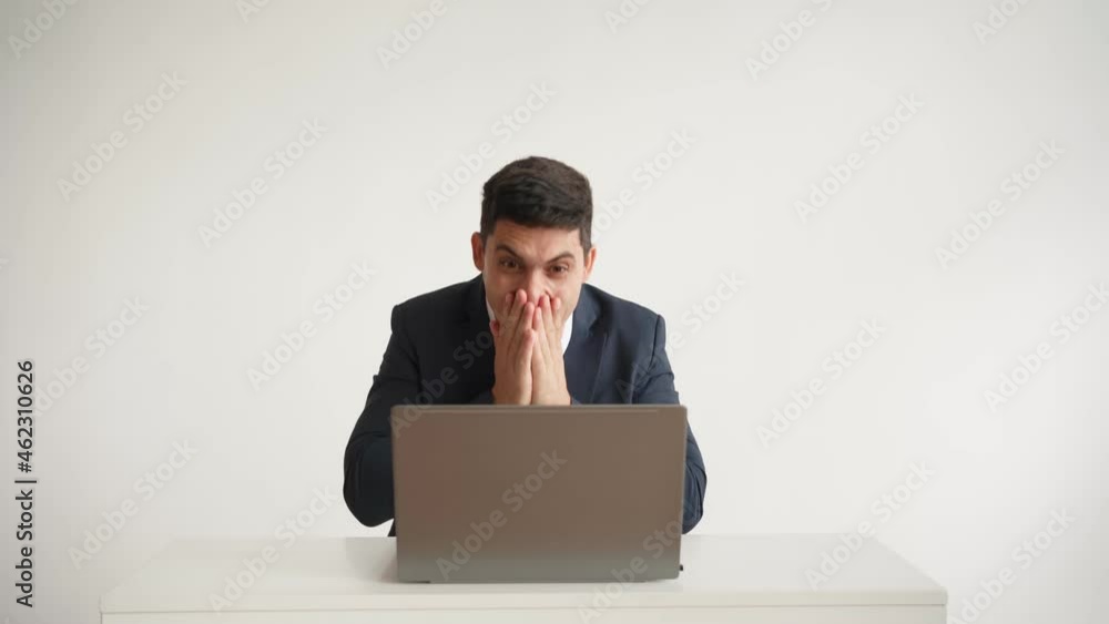 Happy office worker in formal clothes jacket and tie works at laptop and funny rejoices at successful deal on white background. Emotions joy and happiness employee. Great job and career growth concept Happy office worker in formal clothes jacket and tie works at laptop and funny rejoices at successful deal on white background. Emotions joy and happiness employee. Great job and career growth concept