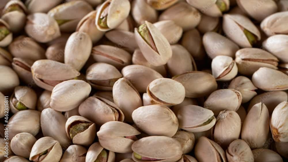 Super Slow Motion Shot of Pouring Roasted Pistachios. Filmed on High Speed Cinematic camera at 1000 fps. Super Slow Motion Shot of Pouring Roasted Pistachios. Filmed on High Speed Cinematic camera at 1000 fps.