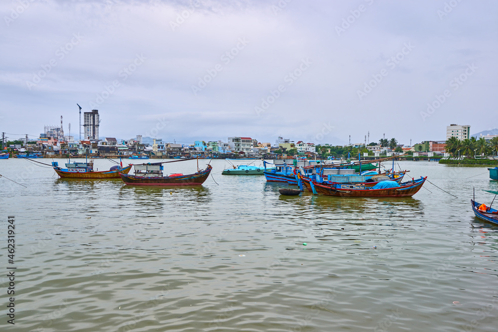Nha Trang, Vietnam- 08 December 2014: Fishing boats in the port of Nha Trang, Vietnam