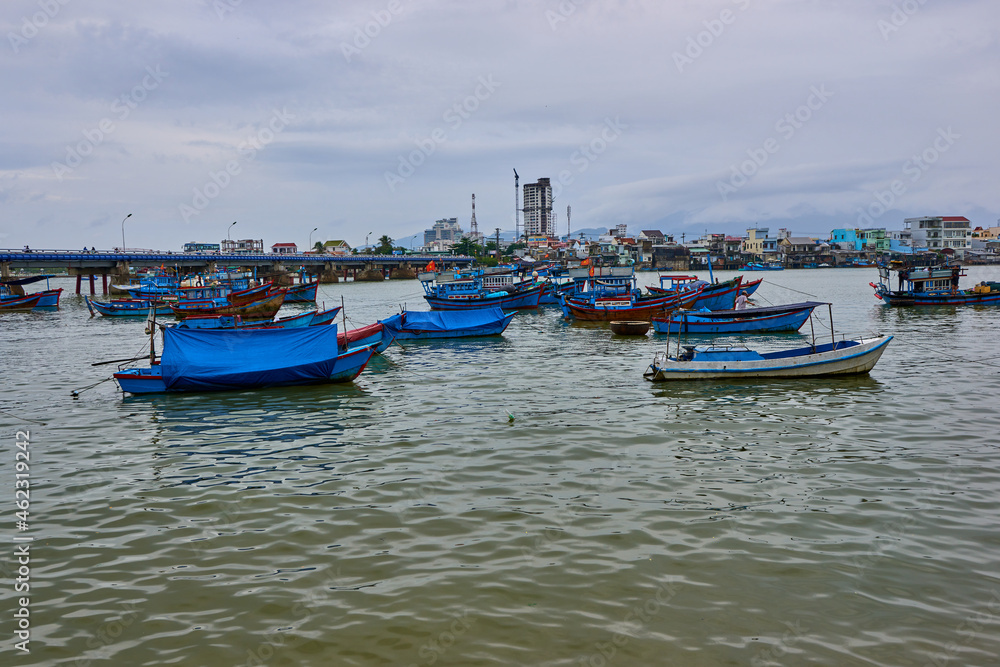 Nha Trang, Vietnam- 08 December 2014: Fishing boats in the port of Nha Trang, Vietnam