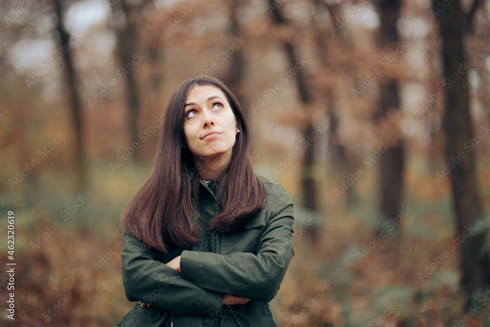 Bored Woman Looking at Foliage in Autumn Season Bored Woman Looking at Foliage in Autumn Season