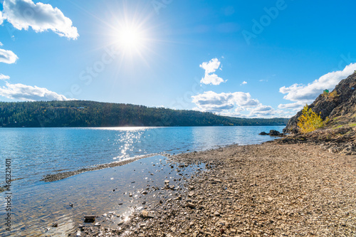 View from the beach along the north shores of Lake Coeur d'Alene near Beacon Point and the Centennial Trail in Coeur d'Alene, Idaho. photo