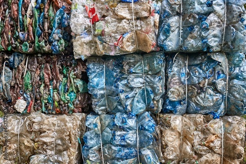 Plastic bottles in bales for waste recycling photo
