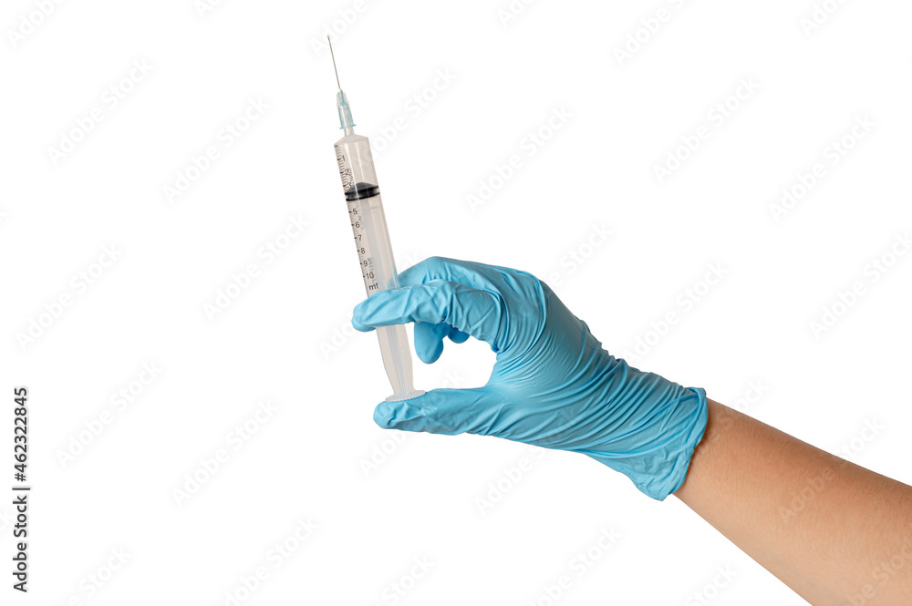 Hand in blue glove holding syringe isolated on white background. Hand in blue glove holding syringe isolated on white background.