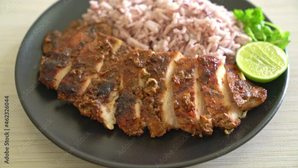 spicy grilled Jamaican jerk chicken with rice - Jamaican food style spicy grilled Jamaican jerk chicken with rice - Jamaican food style