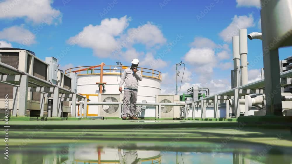 Service engineer to check ACU Aircondition Unit on top of building Service engineer to check ACU Aircondition Unit on top of building