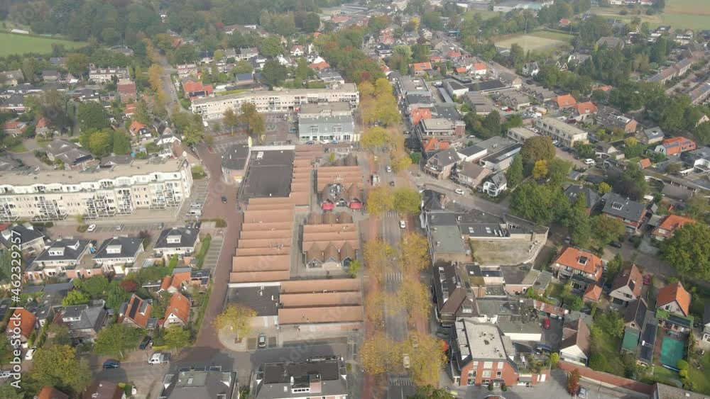 Aerial of street running through a beautiful small town in autumn Aerial of street running through a beautiful small town in autumn