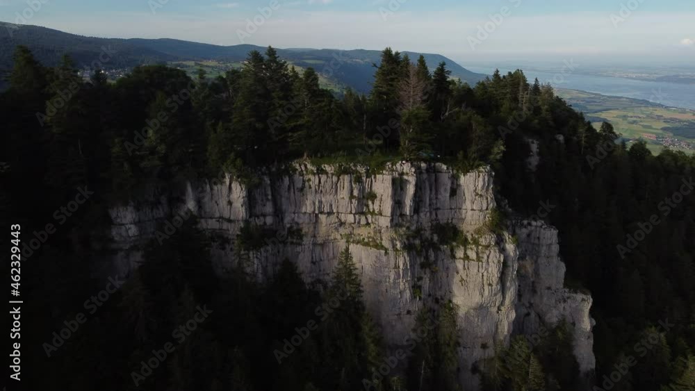 Fast aerial shot over the cliffs and through the trees of Sainte Croix, Switzerland on a sunny day. Fast aerial shot over the cliffs and through the trees of Sainte Croix, Switzerland on a sunny day.