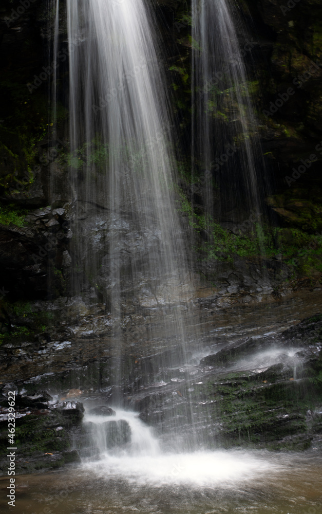 Waterfalls cascading over rocks in the forest. Waterfalls cascading over rocks in the forest.