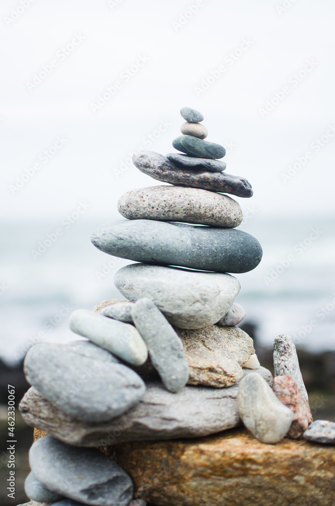 Balanced stack of stones on beach Balanced stack of stones on beach