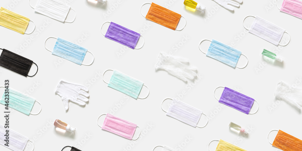 Protective colorful face masks Pattern with medical surgical masks, hand sanitizer gel and rubber gloves Protective colorful face masks Pattern with medical surgical masks, hand sanitizer gel and rubber gloves