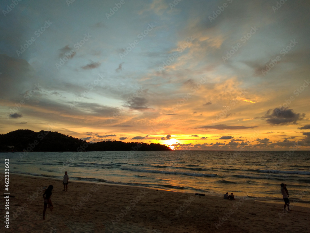 The sunset at Catch Beach Club, Laguna Beach,  one of the beautiful beaches on Phuket island. it is famous place for sightseeing, relaxing, seeing the sunset, swimming, dinner. - Phuket, Thailand, 10/
