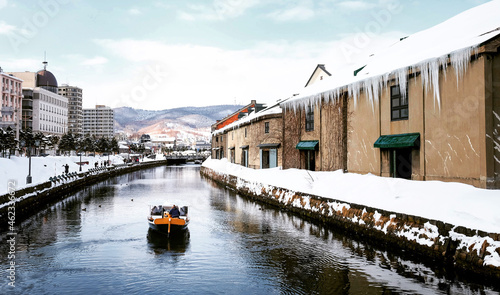 View of Otaru Canel in Winter season with signature tourist boat, Hokkaido - Japan