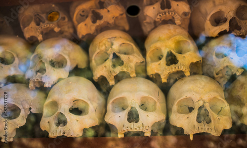 Pile of human skulls on a wat thmei at Siem Reap, Cambodia. photo