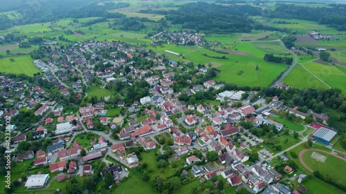 Aerial around the village Wilhelmsdorf in Germany on a cloudy day in summer photo