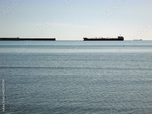 Silhouette of a ship at sea.