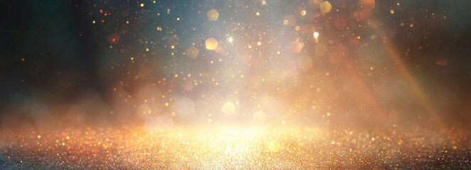 background of abstract glitter lights. gold, blue and black. de focused