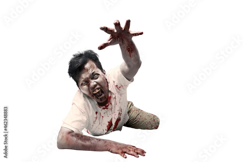 Photos Scary zombie with blood and wound on his body crawling